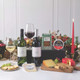 Wine and Cheese Gift Set featuring red and white wine bottles, artisan Irish cheeses, crackers, and grapes arranged with festive holiday decorations – available at GiftsDirect.com Wine and Cheese Gift Set featuring red and white wine bottles, artisan Irish cheeses, crackers, and grapes arranged with festive holiday decorations – available at GiftsDirect.com
